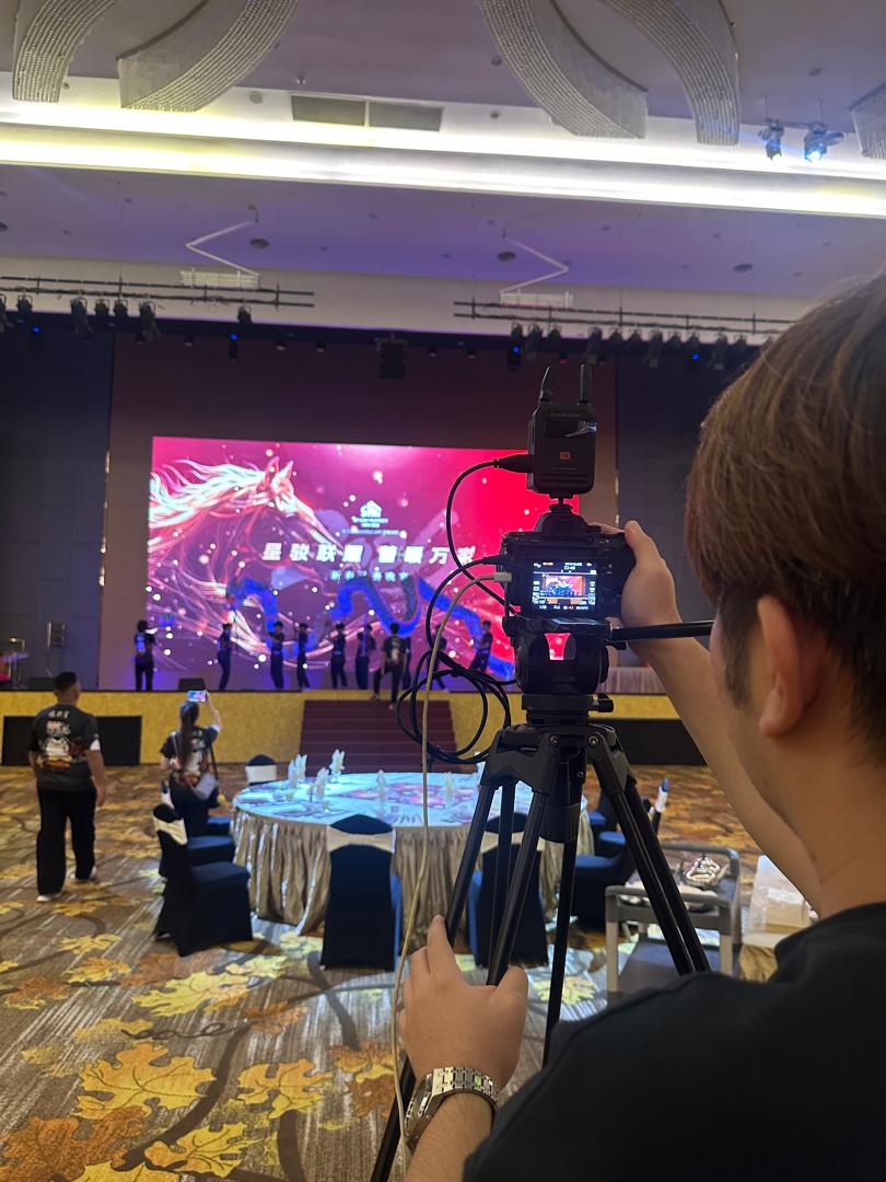 Camera operator preparing an event live streaming setup